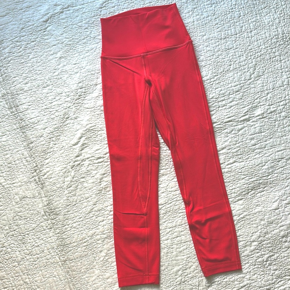 Coral color Lululemon Wundertrain leggings. Size 0